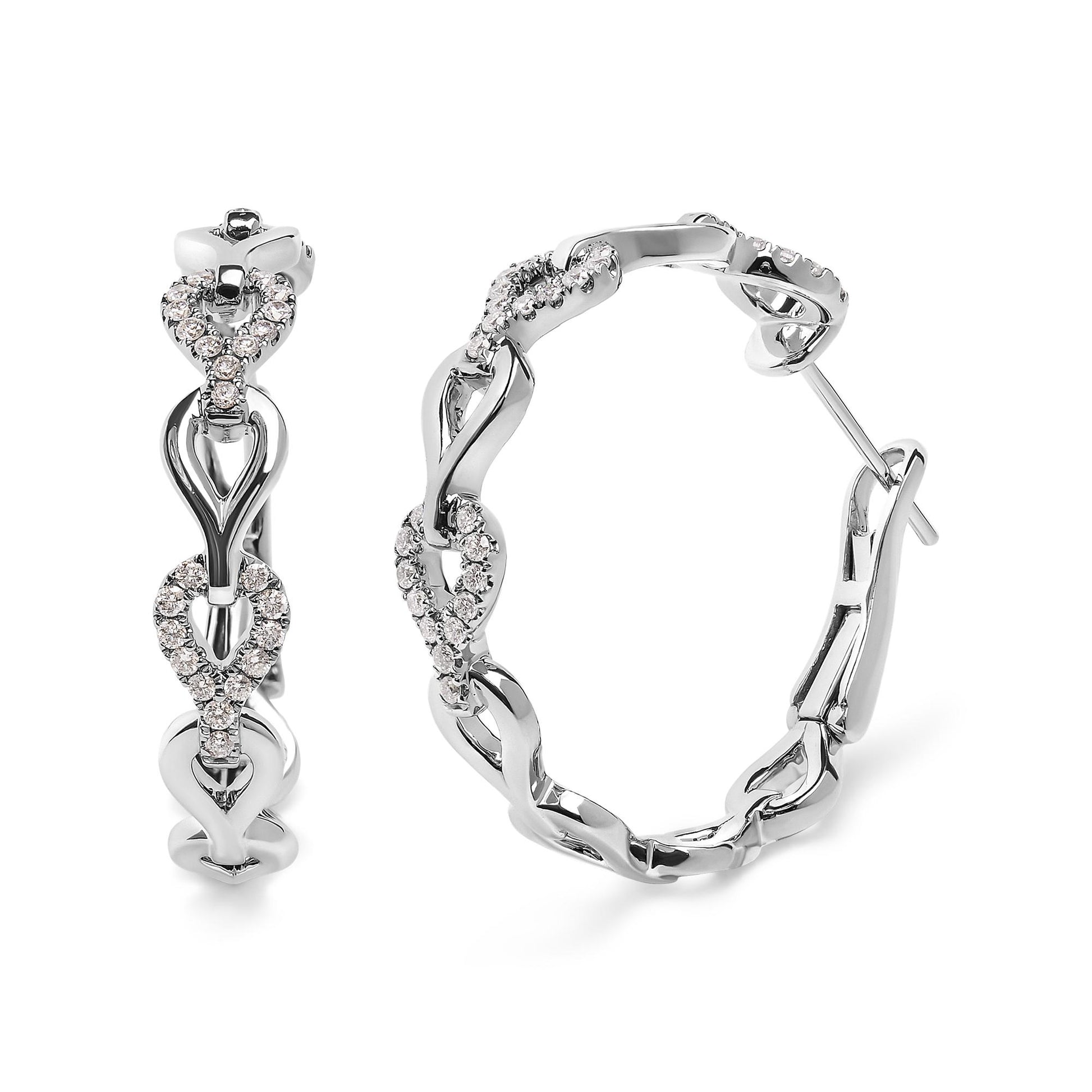 Close-up of white metal hoop earrings with interlocking loop design, featuring small round white gemstones in prong settings, shown from front and side angles.