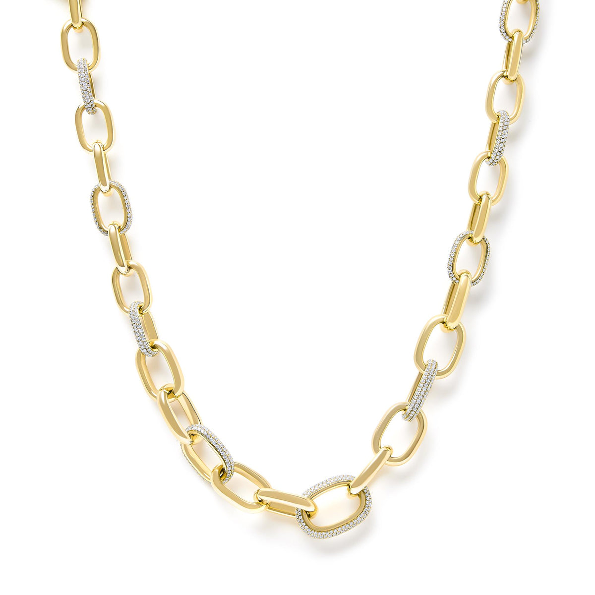 Close-up front angle of a yellow necklace featuring elongated chain links, some adorned with pave-set white gemstones.