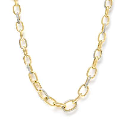 Close-up front angle of a yellow necklace featuring elongated chain links, some adorned with pave-set white gemstones.