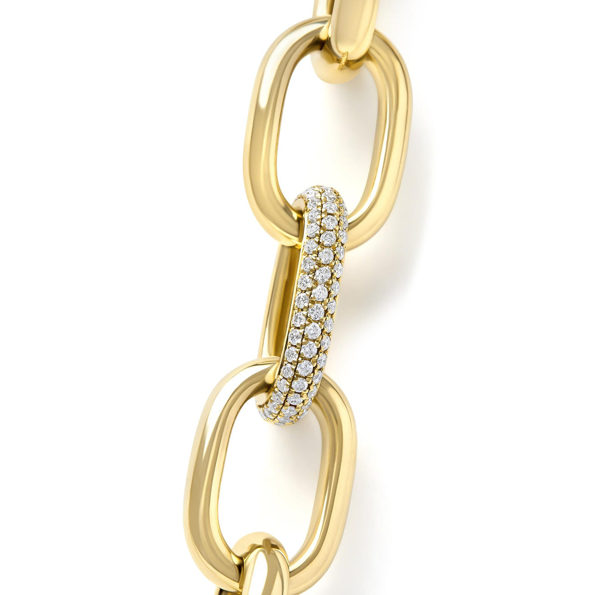 Close-up front angled view of a yellow metal necklace with large oval links, one link set with multiple rows of white round pave gemstones.