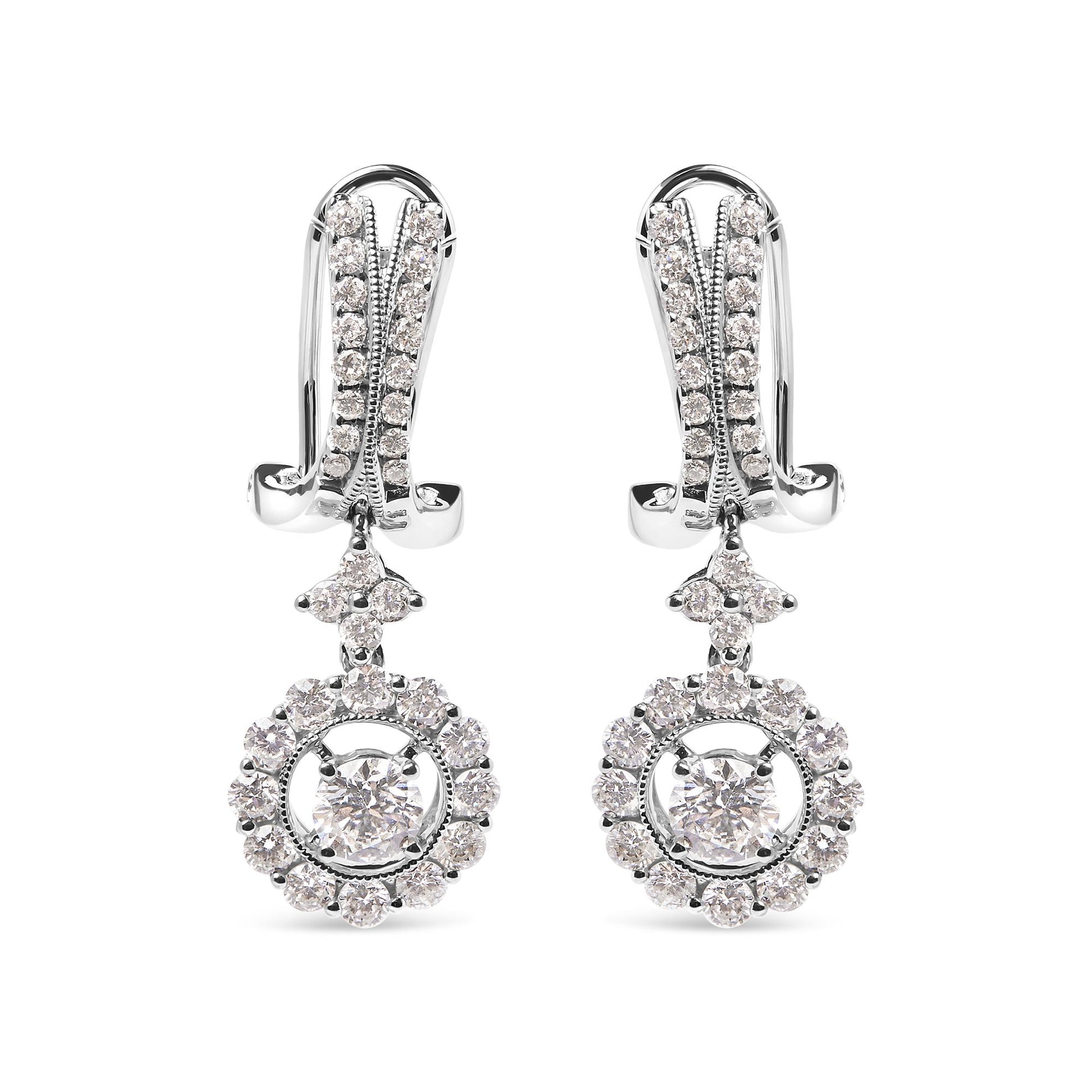 Front view of white metal drop earrings with round white gemstones in prong settings, featuring a small cluster above a circular gemstone halo with a larger central gemstone.