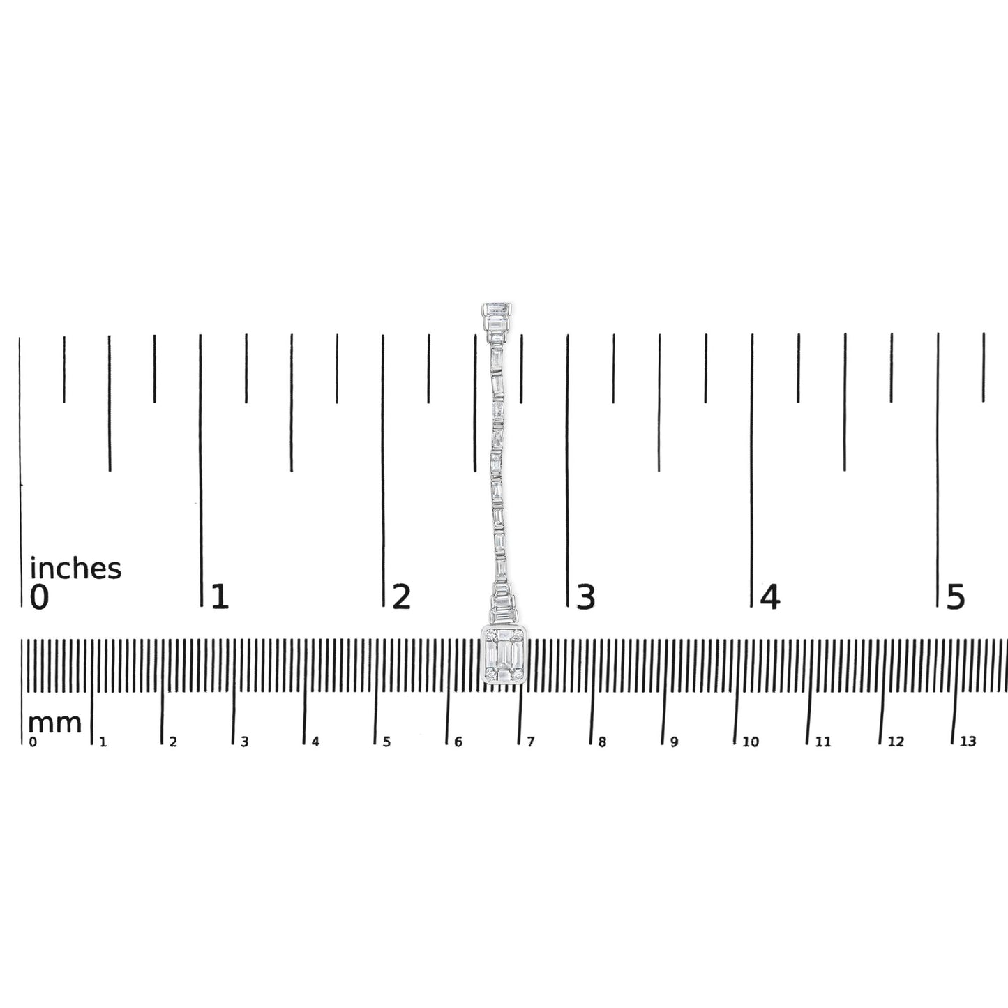 Single white metal earring with round and baguette white gemstones in bezel and channel settings, shown from front on a ruler for size reference.