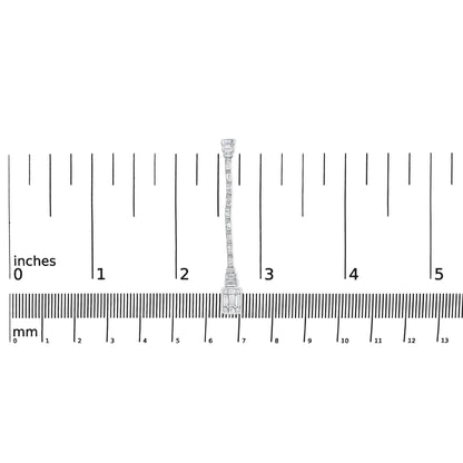 Single white metal earring with round and baguette white gemstones in bezel and channel settings, shown from front on a ruler for size reference.