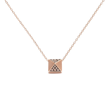 Front-facing shot of a rose-colored metal necklace with a square pendant featuring triangular sections, two of which are inset with round brown gemstones in a pave setting.