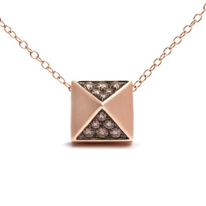 Front view of a rose-colored necklace with a square pendant featuring two triangular sections inset with round, brown pave-set gemstones.