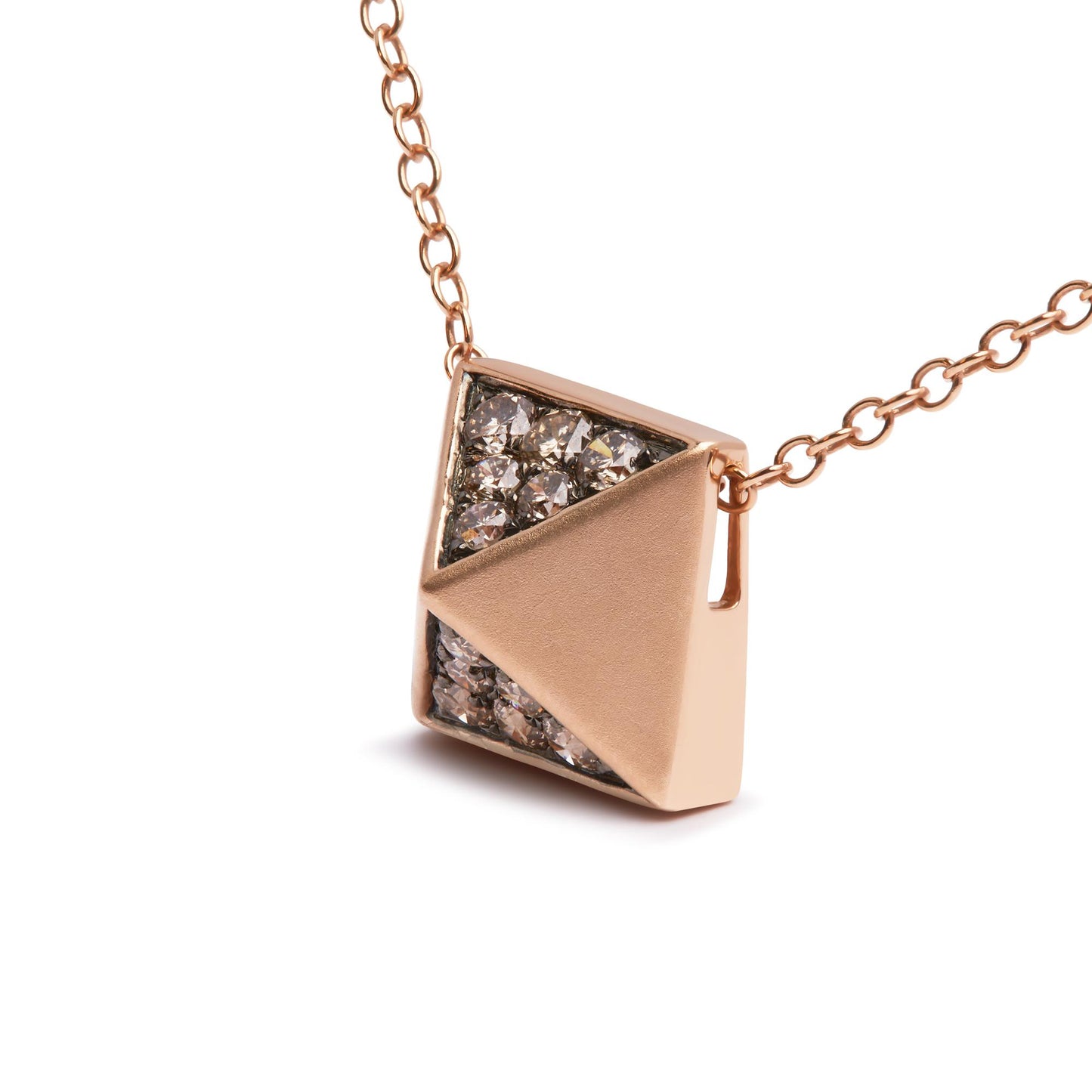 Close-up angled view of a rose-colored necklace with a geometric pendant, featuring a triangular pave setting with round brown gemstones on half of the pendant.