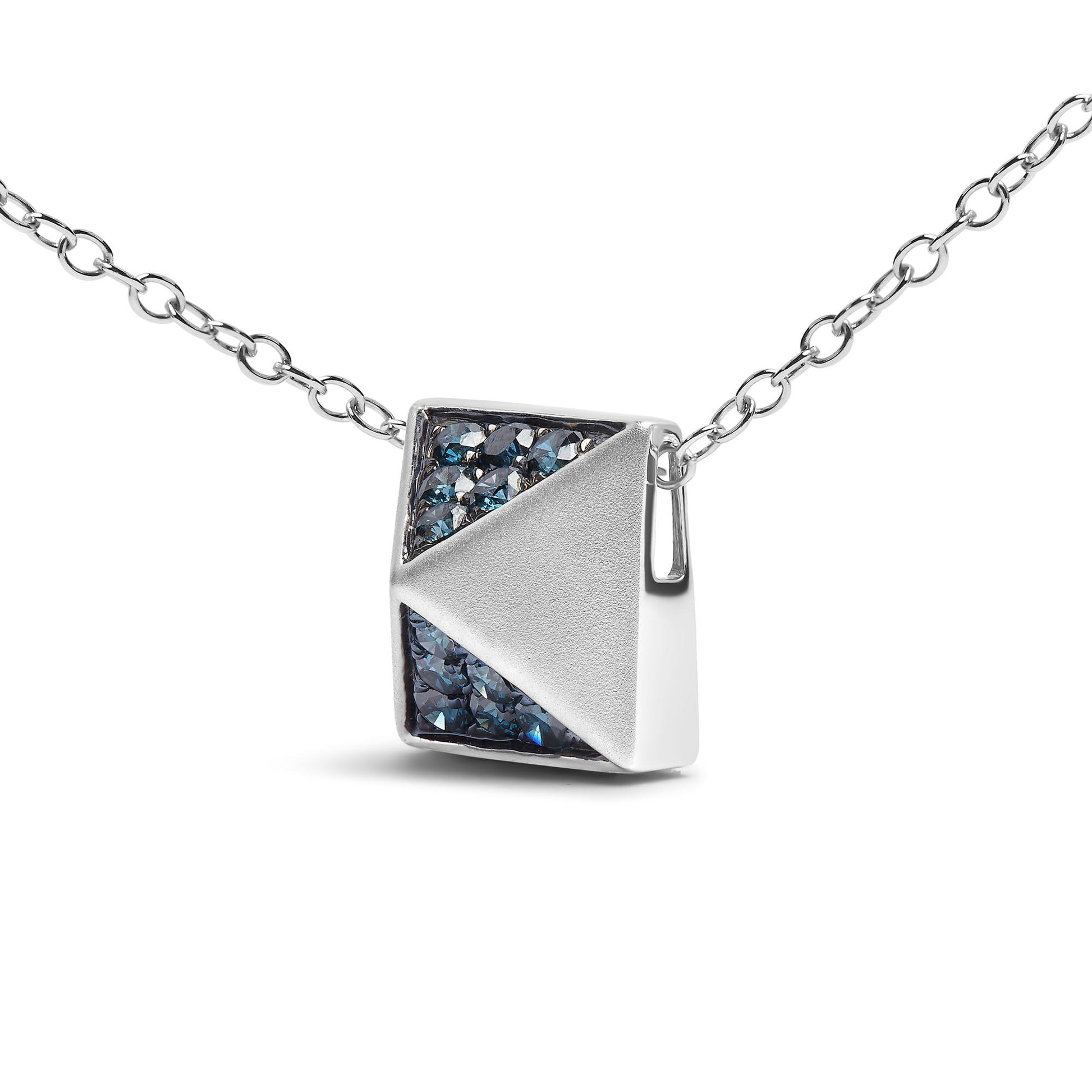 Close-up front view of a white metal necklace with a square pendant featuring a triangle of pave-set round blue gemstones and a smooth triangular section.