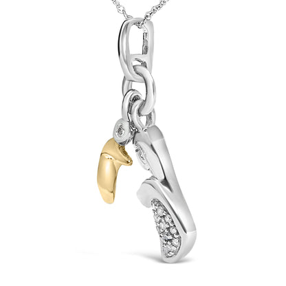 Close-up front angle of a yellow metal necklace pendant featuring two curved charms, one with a single white round gemstone in bezel setting and the other adorned with multiple white round gemstones in pave setting.