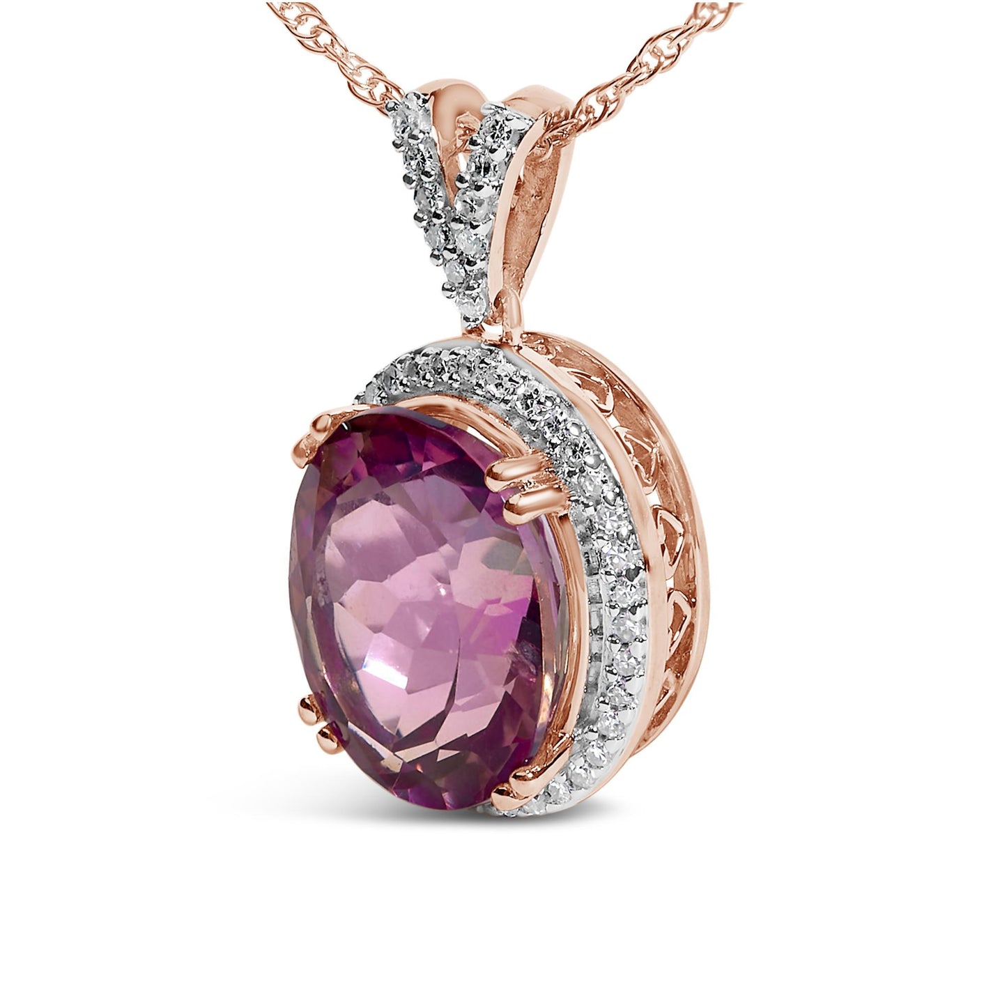 Close-up front angle of a rose metal necklace pendant featuring an oval pink gemstone in a prong setting, surrounded by two curved rows of small round white gemstones in prong settings.