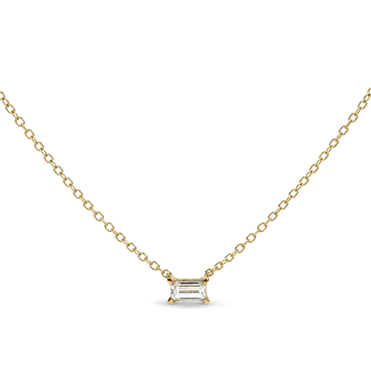 Close-up front view of a yellow necklace with a baguette-shaped white gemstone pendant in a prong setting, shown flat.