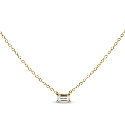 Close-up front view of a yellow necklace with a baguette-shaped white gemstone pendant in a prong setting, shown flat.