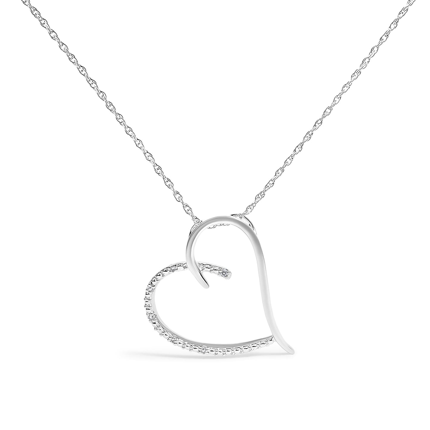 Front view of white metal heart-shaped necklace with one side smooth and the other side adorned with small white gemstones in prong settings.