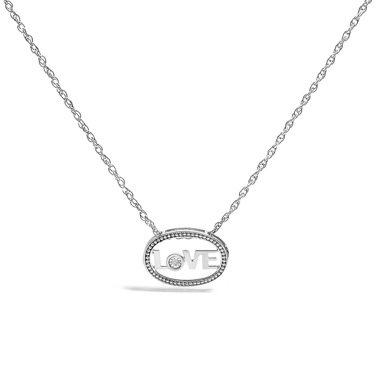 Front-facing shot of a white necklace with an oval pendant featuring the word 'LOVE' with a round white gemstone set in the 'O'.