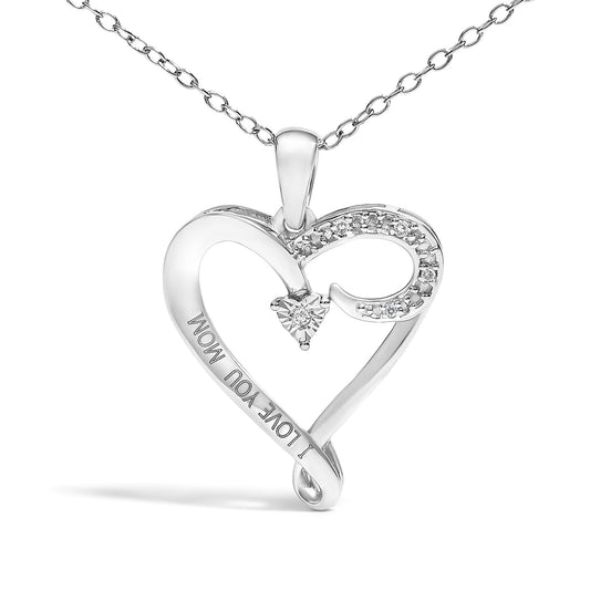 Front angle of a white metal heart-shaped necklace pendant with engraved text 'I LOVE YOU MOM,' featuring round white gemstones set along one curve and one triangular white gemstone in the center.