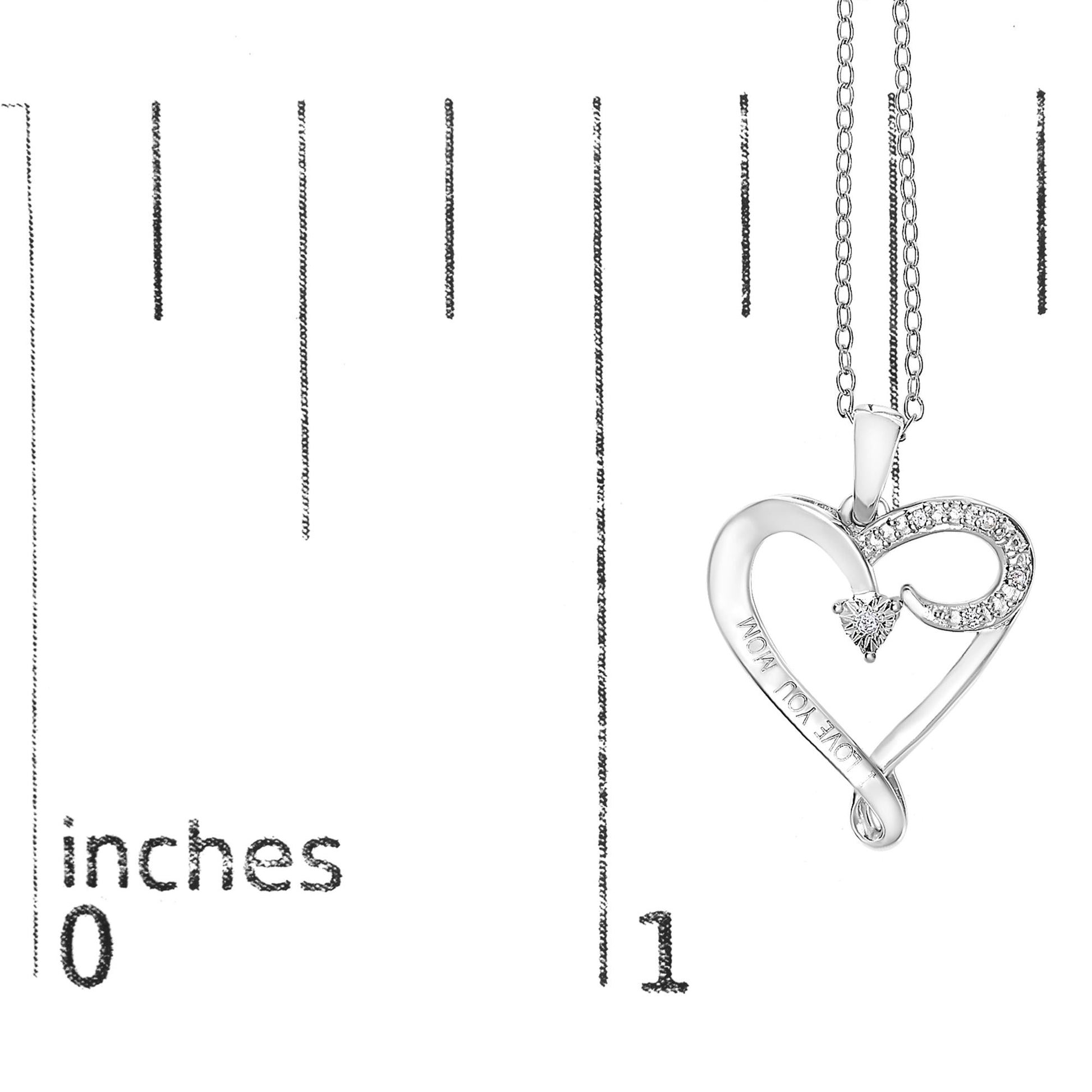 White heart-shaped necklace pendant with five round white gemstones in prong settings, shown on a ruler for size reference, angled slightly to the right.