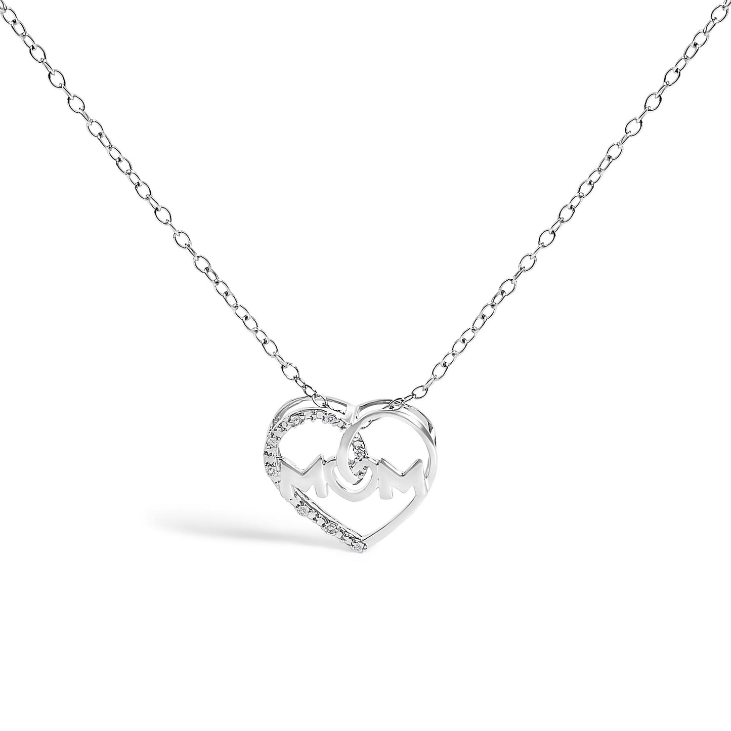 White metal necklace with heart-shaped pendant featuring the word 'MOM' and white round gemstones, shown in a front-facing angle.