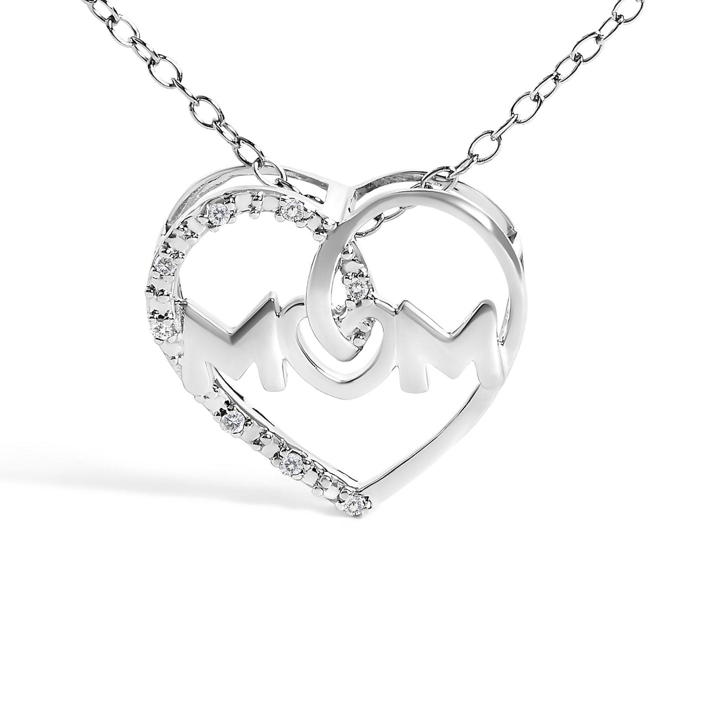 Front angle view of a white metal heart-shaped necklace pendant with the word 'MOM' inside, partially adorned with round white gemstones in prong settings along one side of the heart.