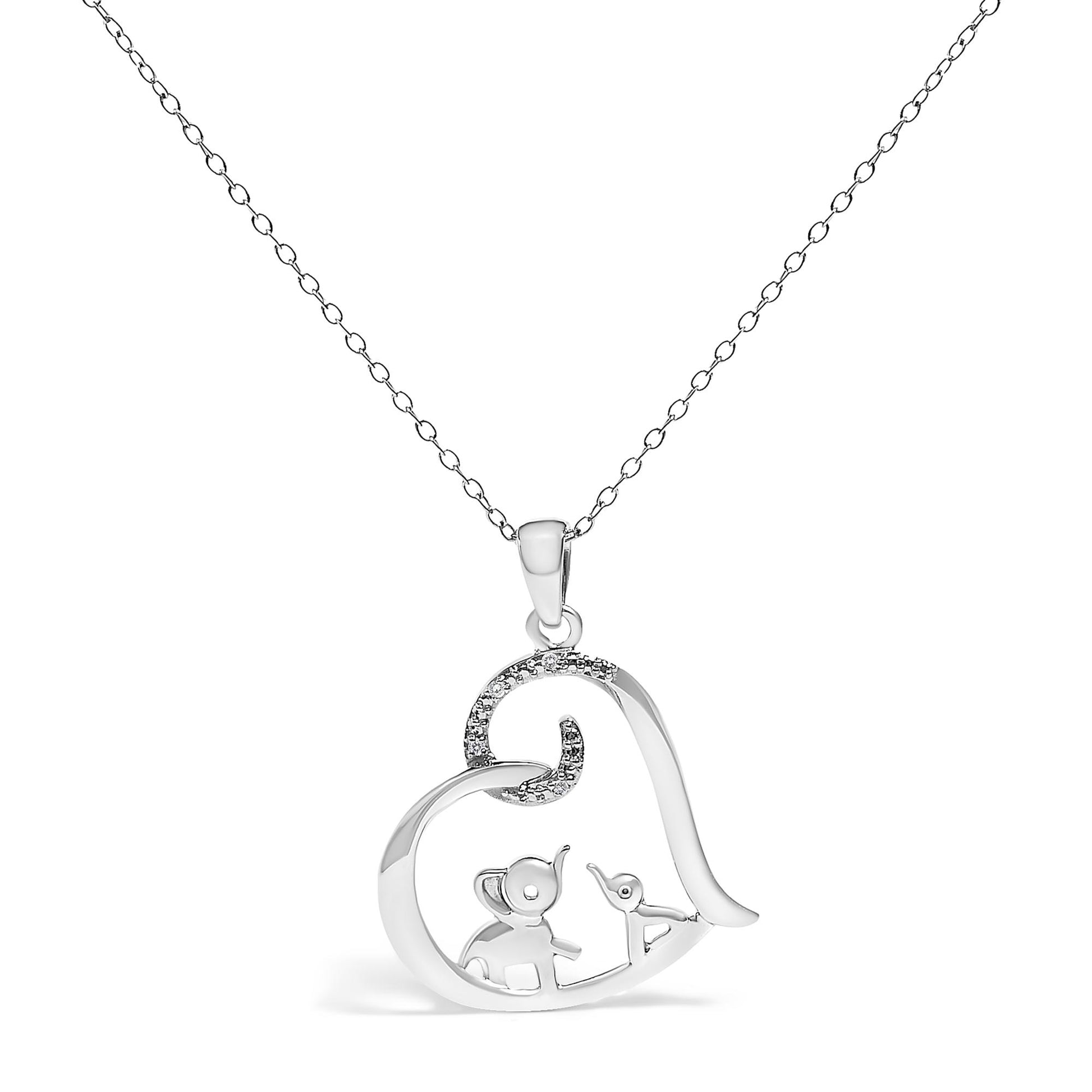 Front view of a white metal heart-shaped necklace pendant featuring an elephant and a bird inside, with part of the heart accented by white round gemstones in prong settings, hanging on a delicate chain.
