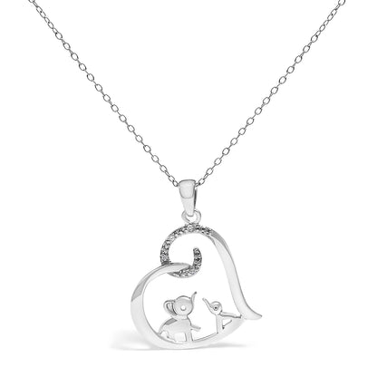 Front view of a white metal heart-shaped necklace pendant featuring an elephant and a bird inside, with part of the heart accented by white round gemstones in prong settings, hanging on a delicate chain.