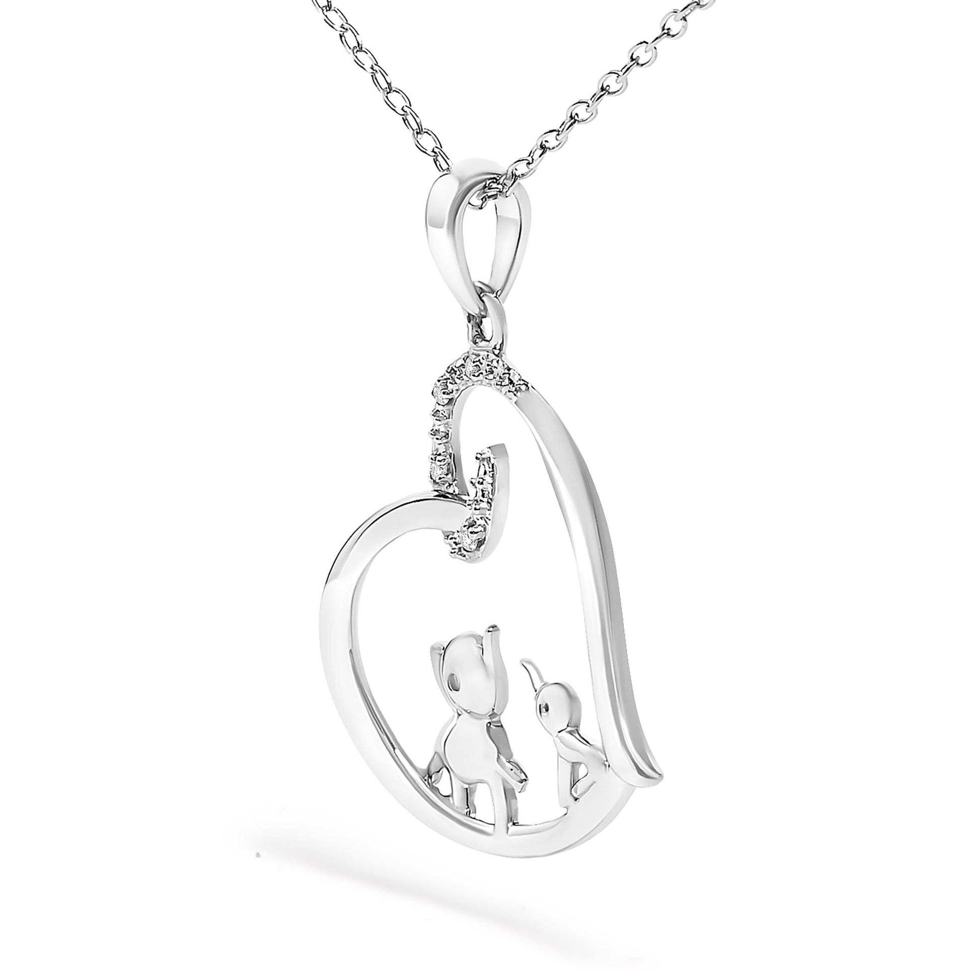 Close-up front angle of white metal heart-shaped necklace pendant with two cat figures inside and four small round white gemstones in prong setting on upper left side.