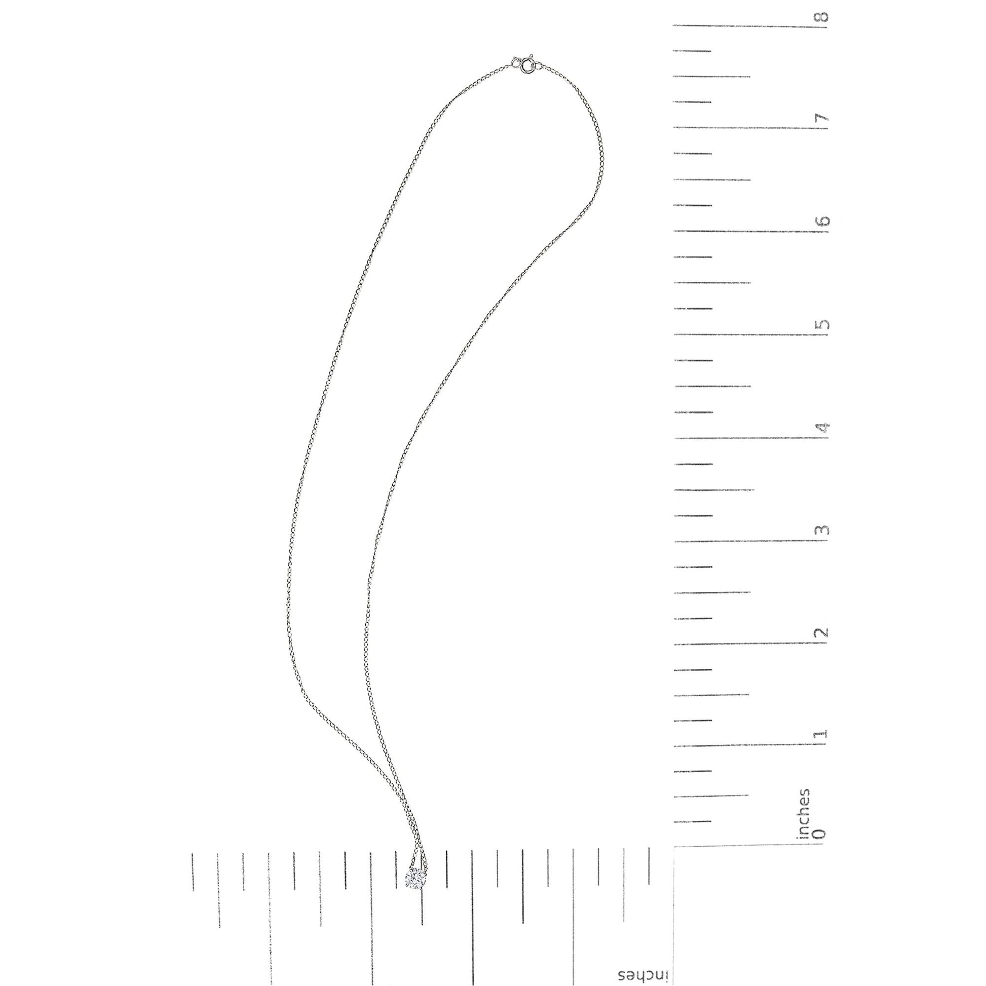 White necklace with a round white gemstone in a four-prong setting, shown lying flat on a scale in a top-down angle.