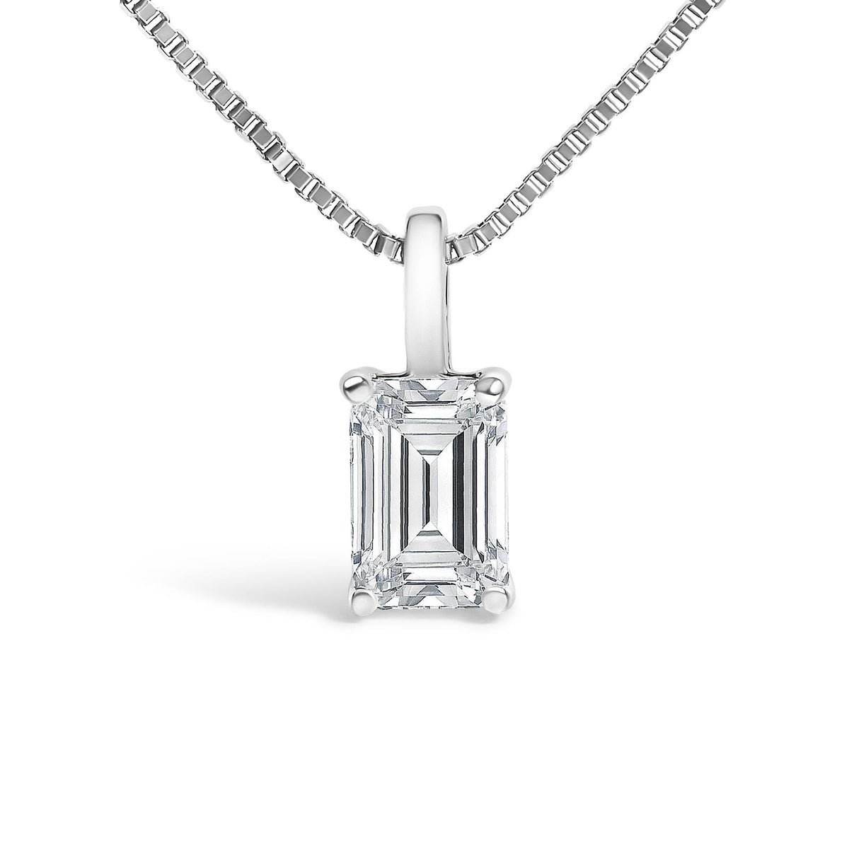 Close-up front view of a white metal necklace featuring a pendant with a single emerald-shaped white gemstone in a four-prong setting.