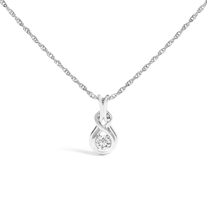 White metal necklace with a pendant featuring an infinity loop design and a single round white gemstone in prong setting, shown from a front angle on a white background.