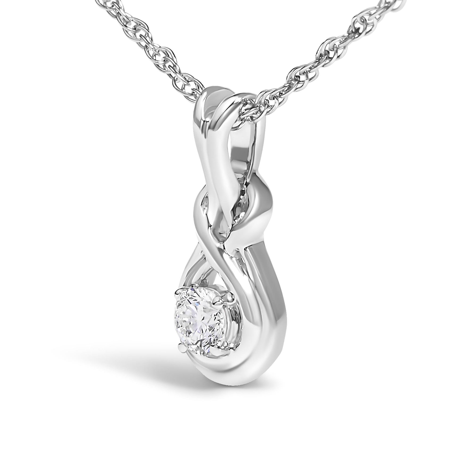 Close-up front angle of a white metal necklace featuring a twisted pendant with a single round white gemstone in prong setting.