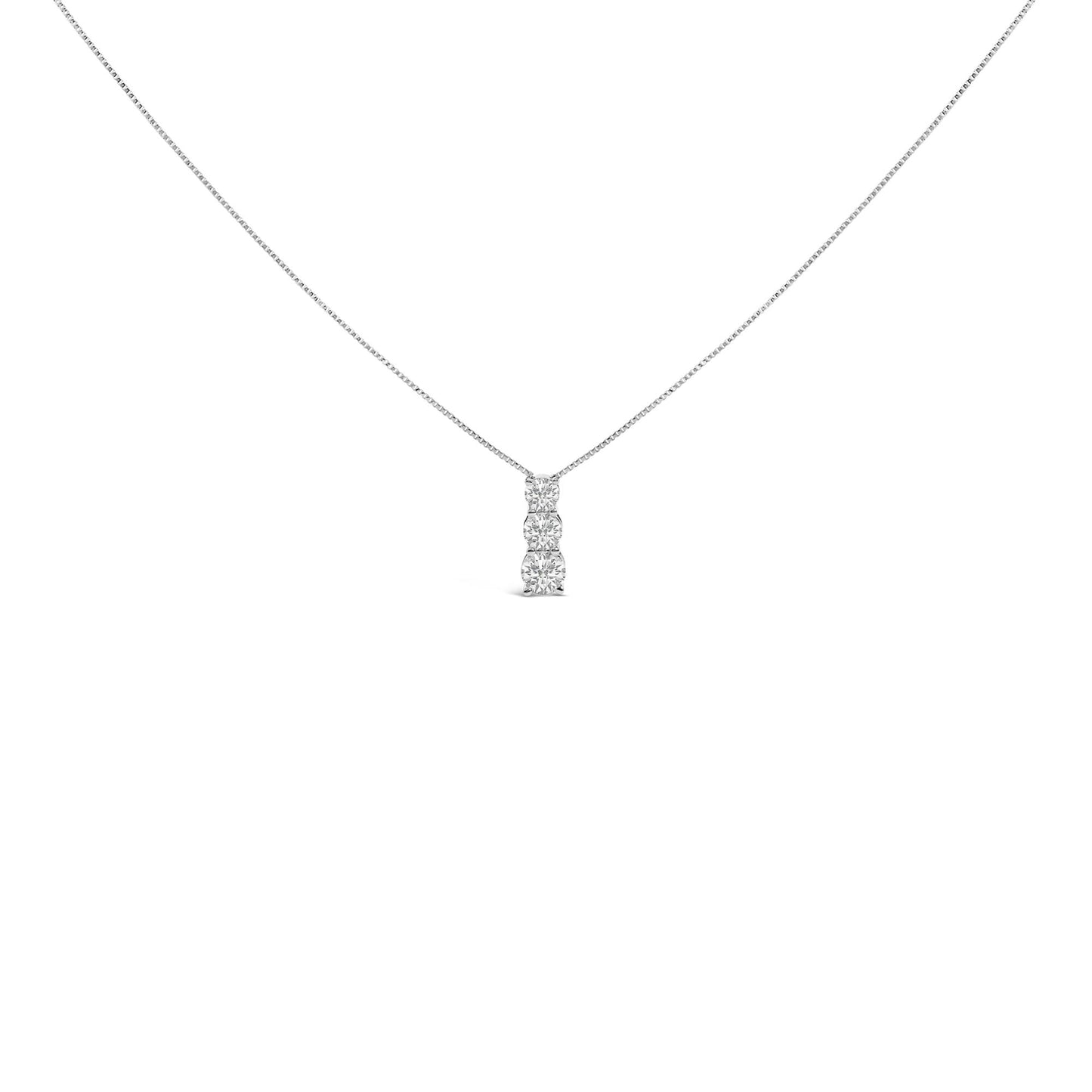 Front view of a white necklace with a vertical pendant featuring three round white gemstones in a shared prong setting.