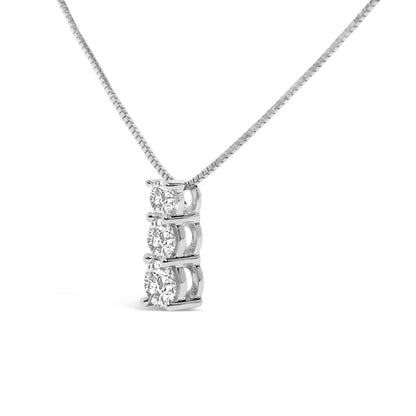 White metal necklace with a vertical pendant featuring three round white gemstones in shared prong settings, shown in a close-up front angle.