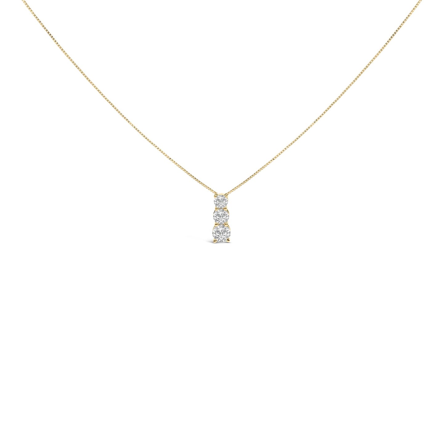 Front angle view of a yellow metal necklace with a vertical pendant featuring three round white gemstones in a shared prong setting.