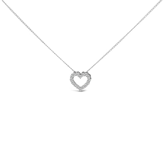 Front view of a white metal necklace with a heart-shaped pendant outlined with round white gemstones in a shared prong setting.
