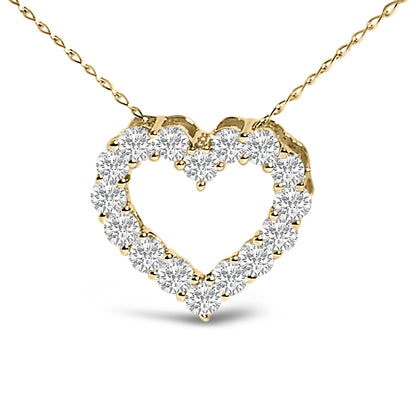 Close-up front view of a yellow metal necklace with a heart-shaped pendant outlined by round white gemstones in a shared prong setting.