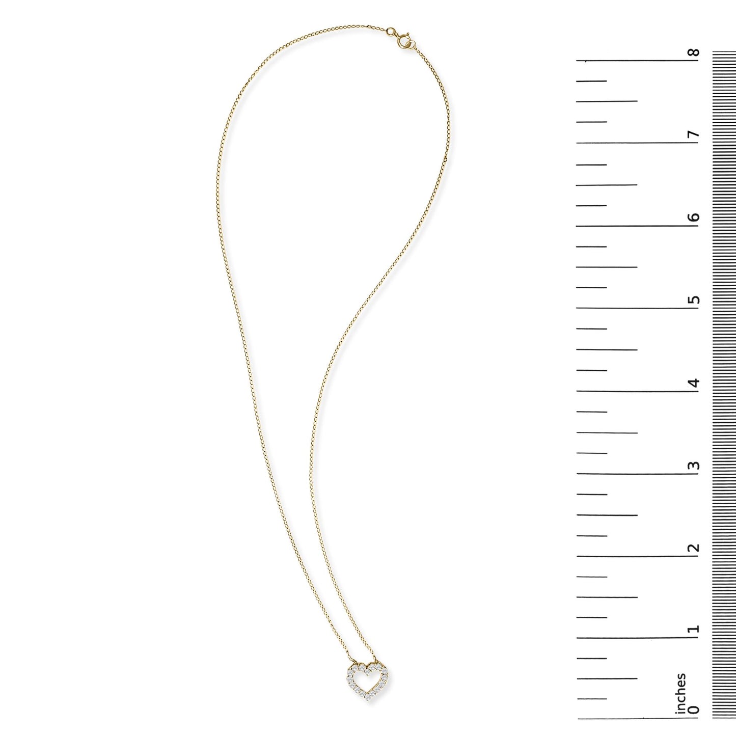 Yellow metal necklace with a heart-shaped pendant set with round white gemstones in a shared prong setting, shown flat on a white background next to a vertical ruler for scale.