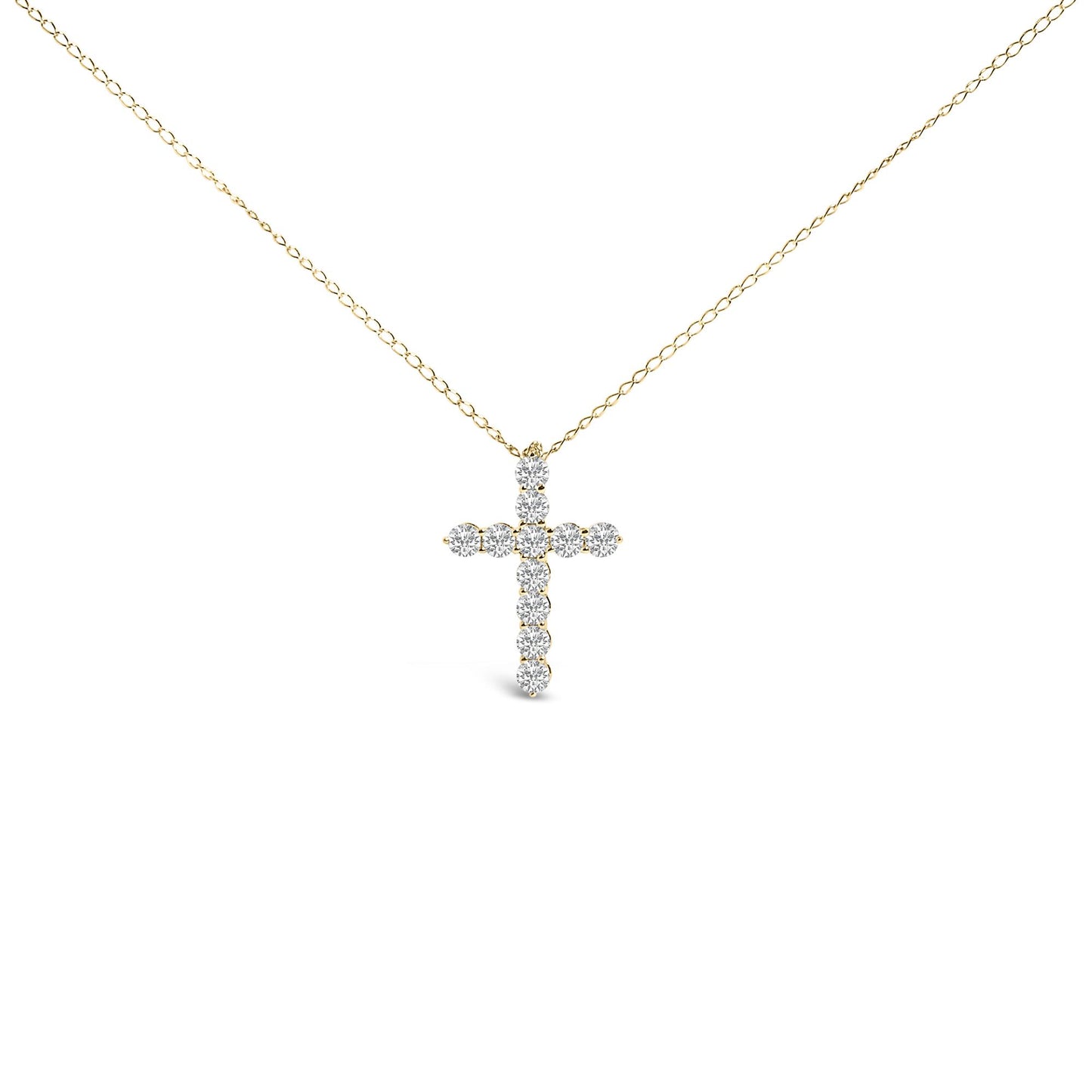 Front-facing shot of a yellow metal necklace with a cross-shaped pendant featuring round white gemstones in a shared prong setting.