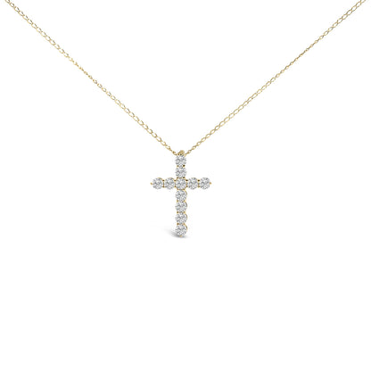 Front-facing shot of a yellow metal necklace with a cross-shaped pendant featuring round white gemstones in a shared prong setting.