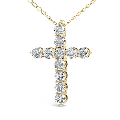 Close-up front view of a yellow metal cross-shaped necklace pendant featuring round white gemstones in a shared prong setting, shown against a white background.