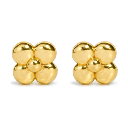 Pair of yellow metal earrings shaped like a stylized flower with four rounded petals and a central round element, shown from the front on a white background.