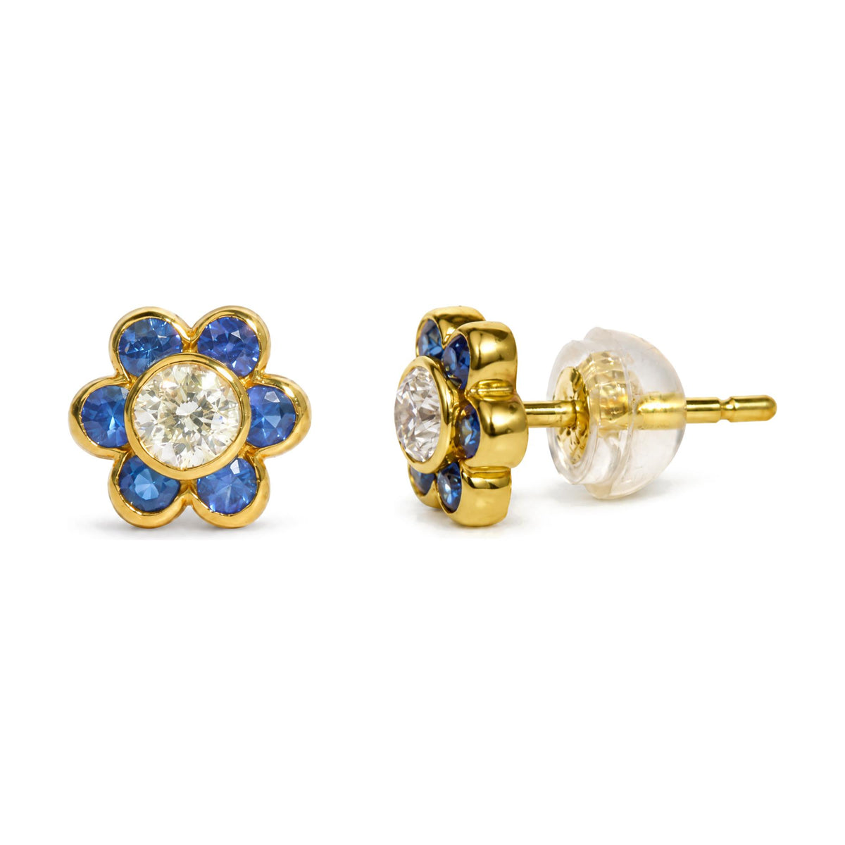 Close-up front and side angle of a single yellow metal flower-shaped stud earring with a white gemstone center and blue gemstones forming petals, shown on a white background.