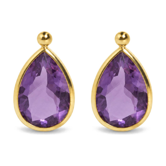 Close-up front view of yellow metal earrings with pear-shaped purple gemstones in bezel setting and round yellow metal studs above.