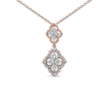 Front-facing close-up of a rose-colored necklace with a double pendant set with multiple white round gemstones in shared prong settings.