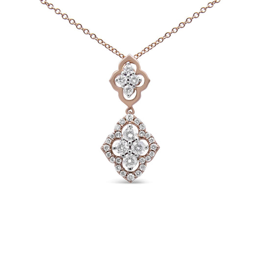 Front-facing close-up of a rose-colored necklace with a double pendant set with multiple white round gemstones in shared prong settings.