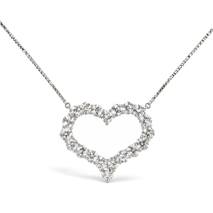 Close-up front view of a white metal necklace with a heart-shaped pendant made of round white gemstones in prong settings.