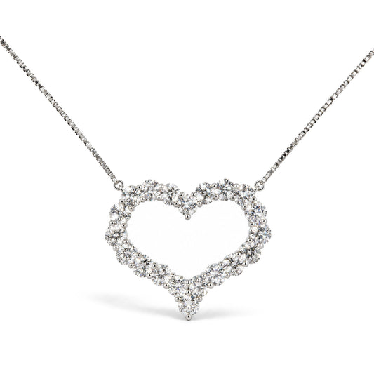 Close-up front view of a white metal necklace with a heart-shaped pendant made of round white gemstones in prong settings.
