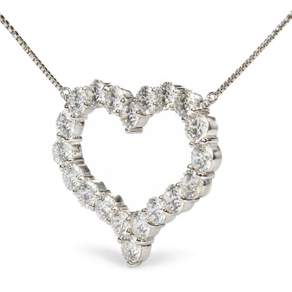 Close-up front angle of a white metal necklace with a heart-shaped pendant made of round white gemstones in prong settings, shown on a white background.