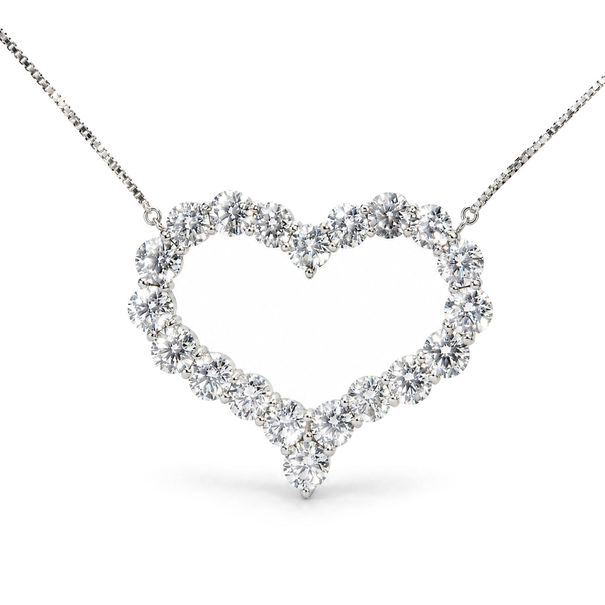 Close-up front view of a white metal heart-shaped necklace pendant featuring round white gemstones in prong settings, displayed on a white background.