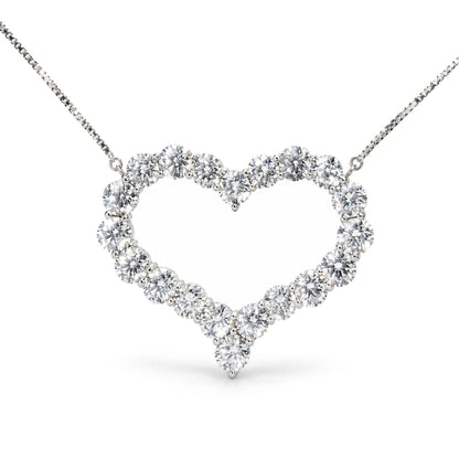Close-up front view of a white metal heart-shaped necklace pendant featuring round white gemstones in prong settings, displayed on a white background.