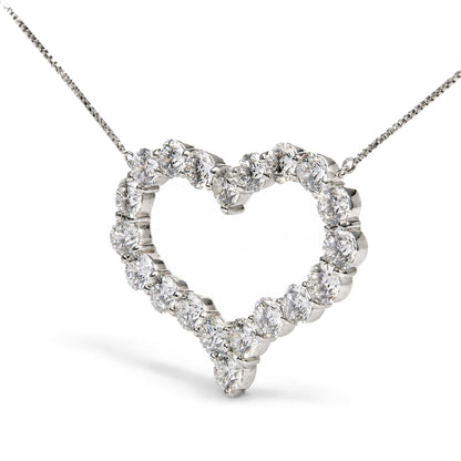 Close-up front angle of a white metal heart-shaped necklace pendant featuring round white gemstones in prong settings along the outline, shown on a white background.