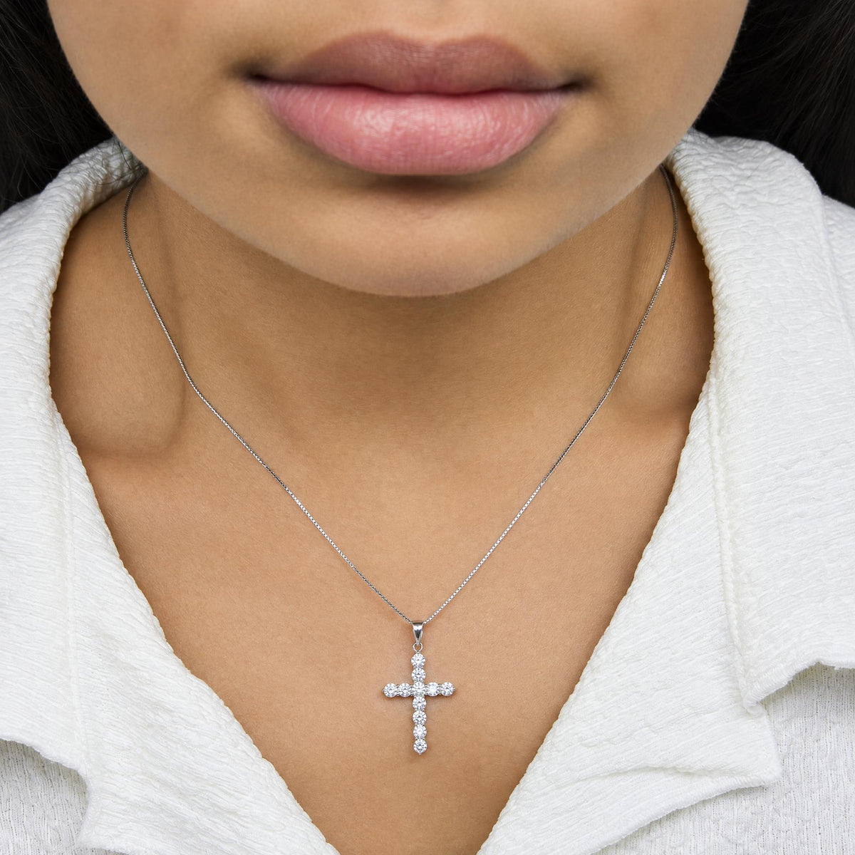 18K white gold cross pendant necklace with round lab-grown diamonds worn on a model
