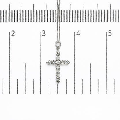 18K white gold lab-grown diamond cross pendant necklace shown on a measurement scale